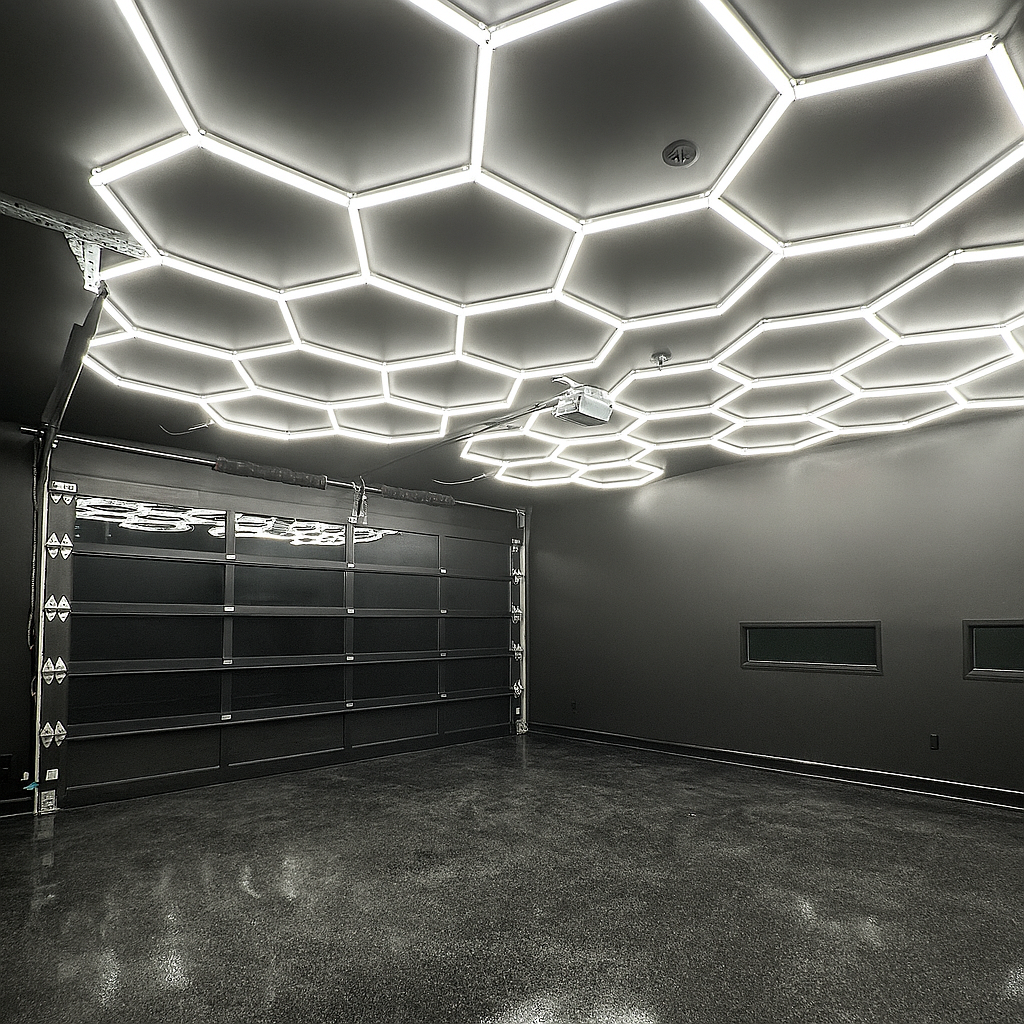 Custom garage build with hexagonal LED lighting and epoxy floor Rivers Construction