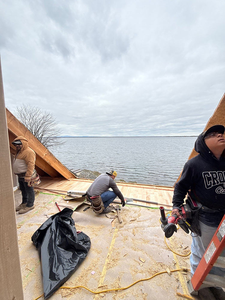 Dormer installation crew at work Lake Champlain Vermont Rivers Construction