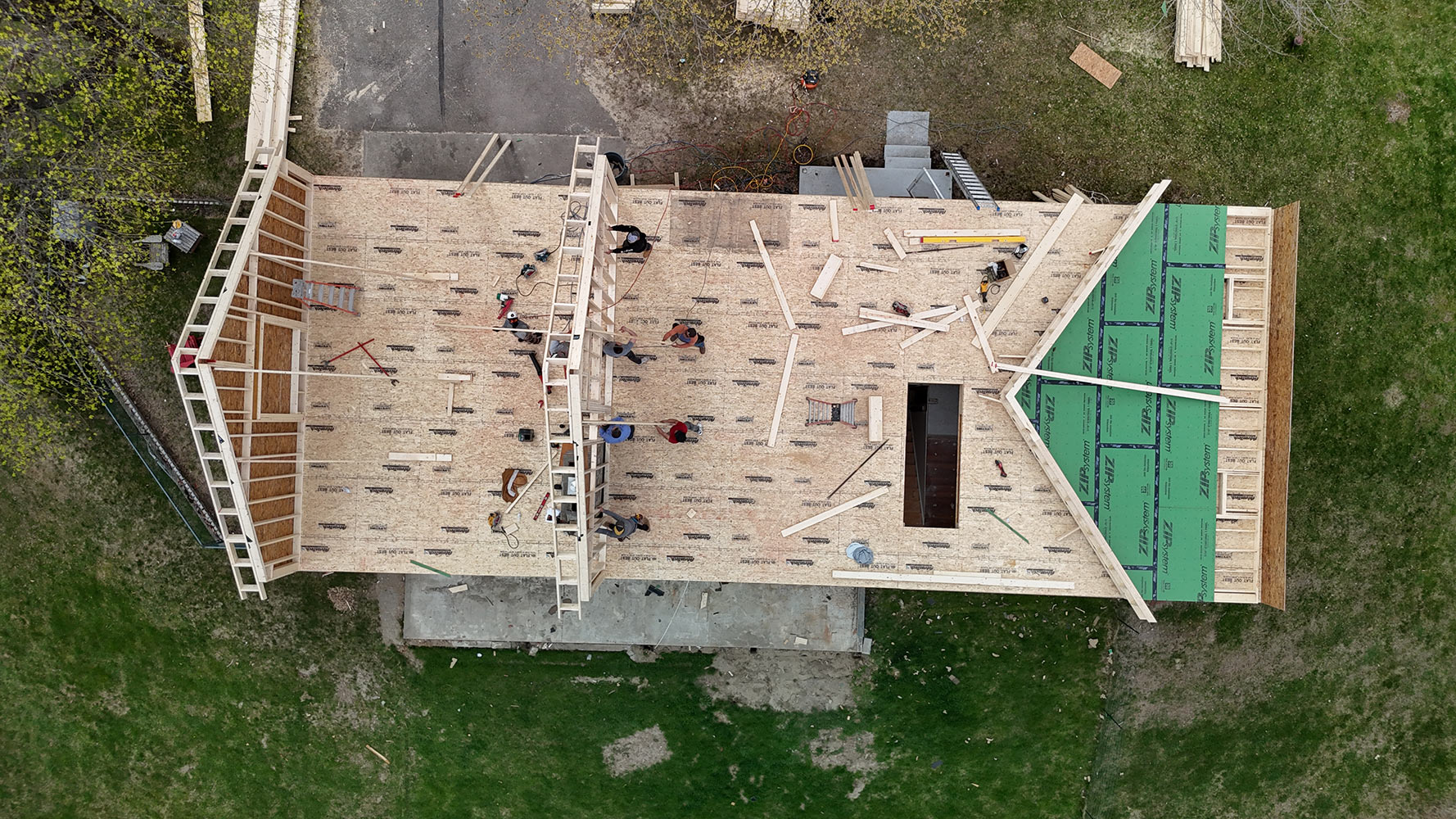 Framing crew decking roof second story addition Williston Vermont overhead