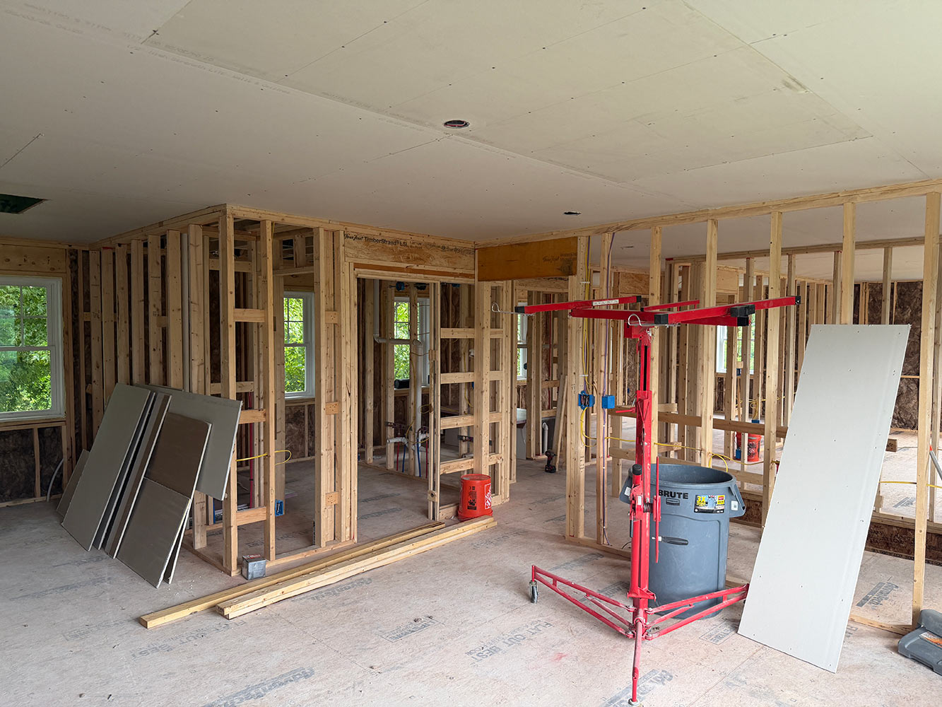 Drywall sheets staged for hang full home renovation Williston Vermont