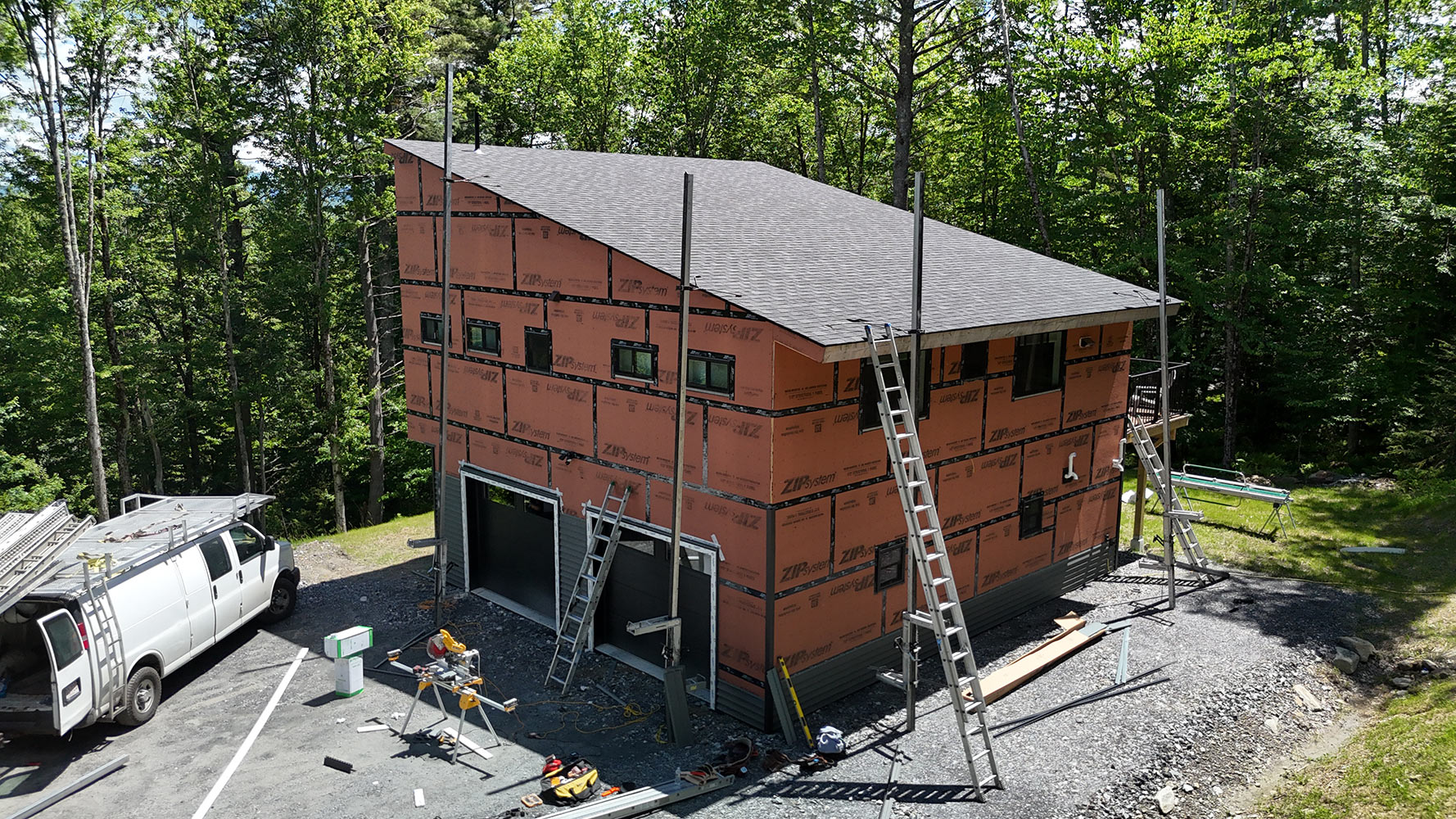 New construction home ZIP System exterior with new shingle roof Stowe Vermont aerial
