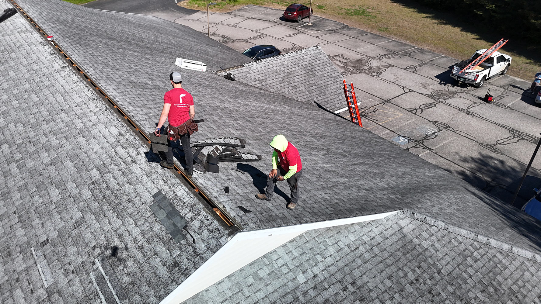 Ridge cap replacement Essex Vermont commercial crew aerial Rivers Construction