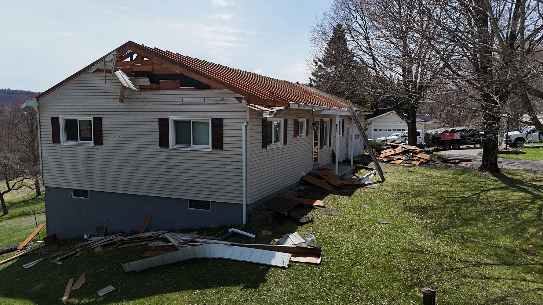 Roof tear-off and truss framing Williston Vermont second floor addition