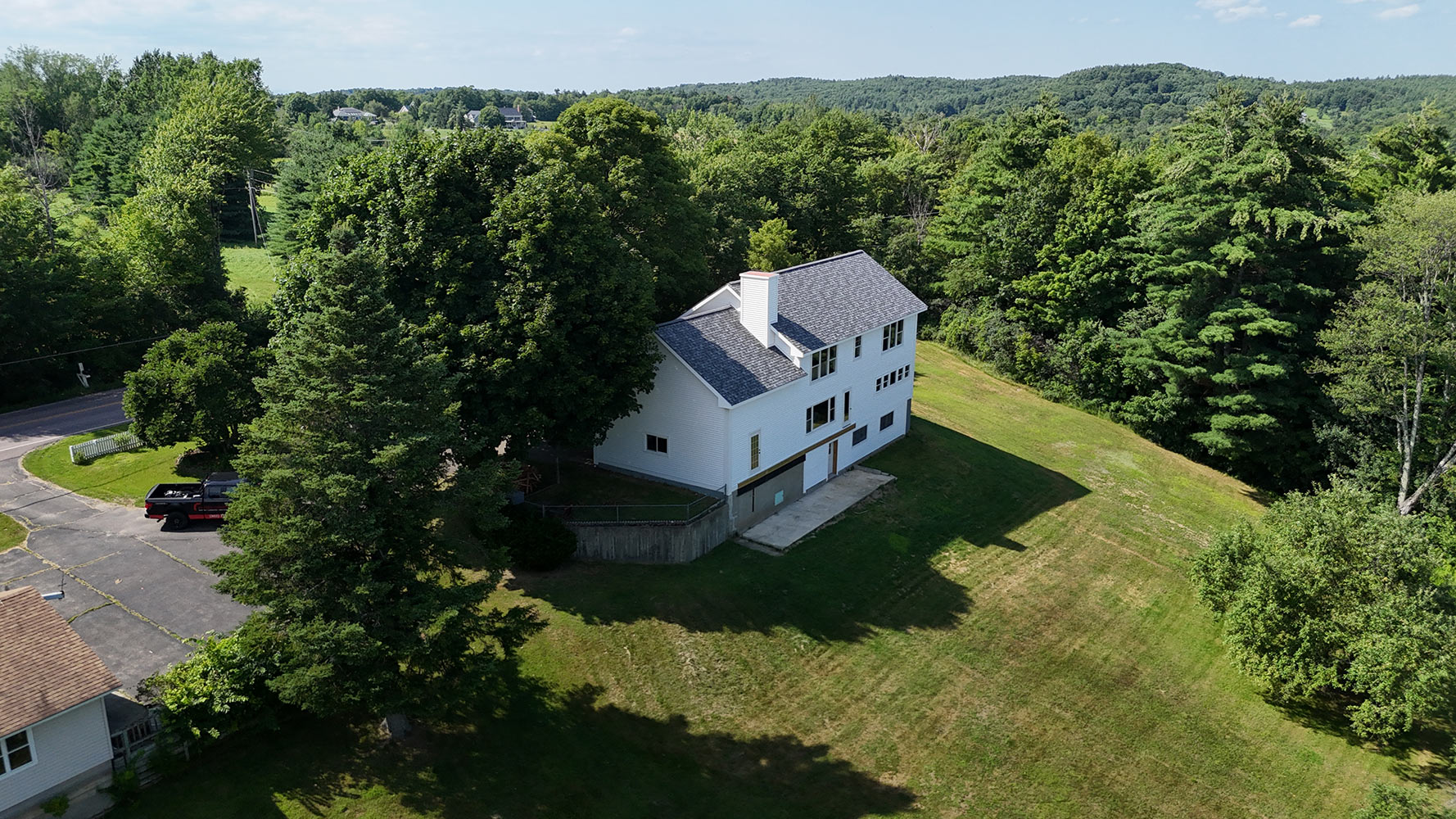 Completed rear exterior full home addition Williston Vermont aerial