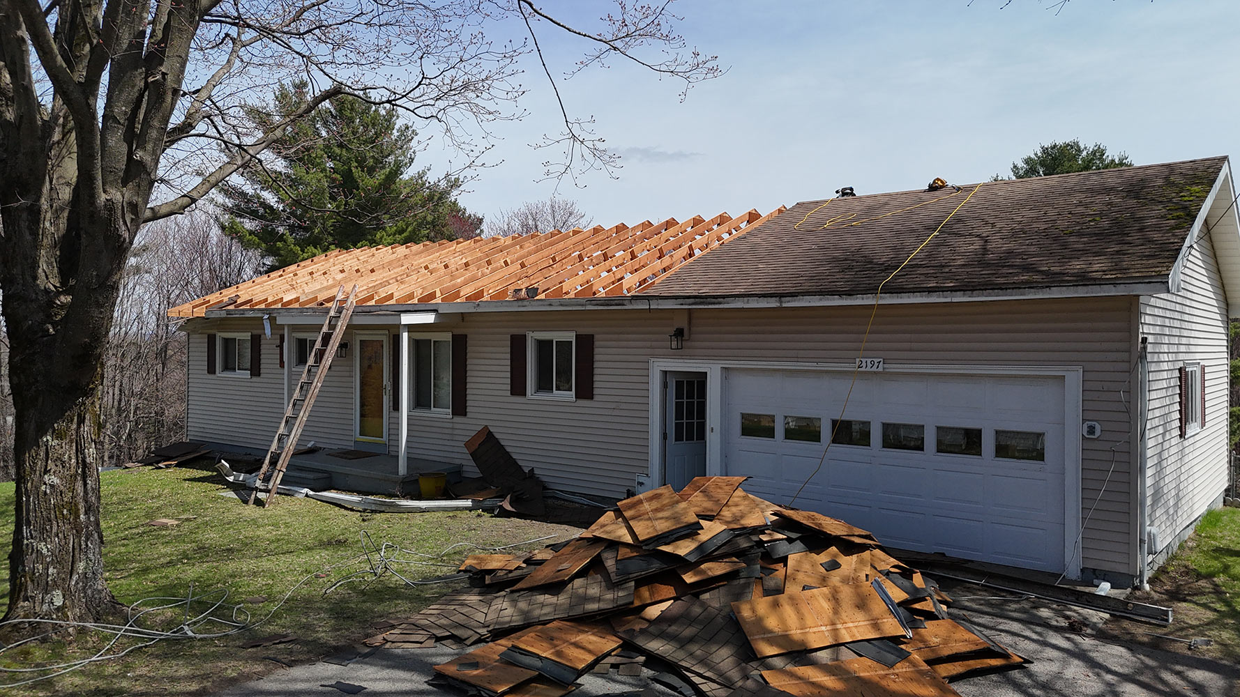 Before: roof tear-off and reframing at front entrance full home addition Williston Vermont