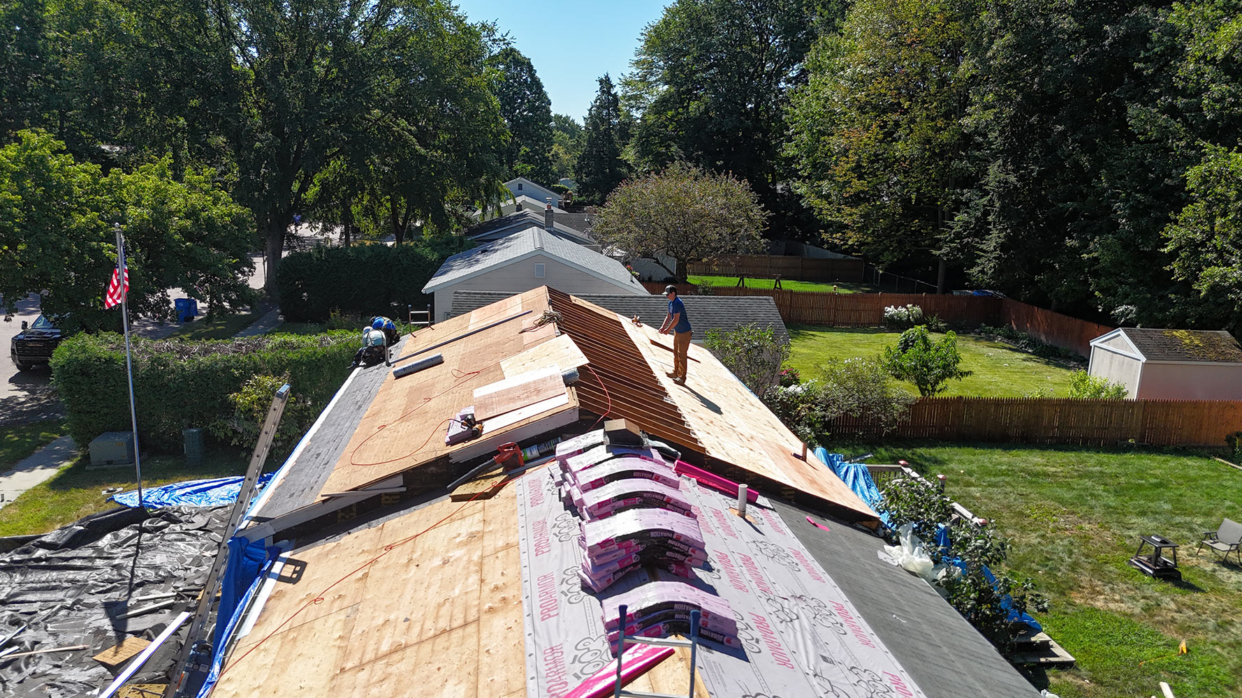 New deck complete with ProArmor underlayment installed and Owens Corning shingle bundles staged along ridge on Burlington Vermont residential roof