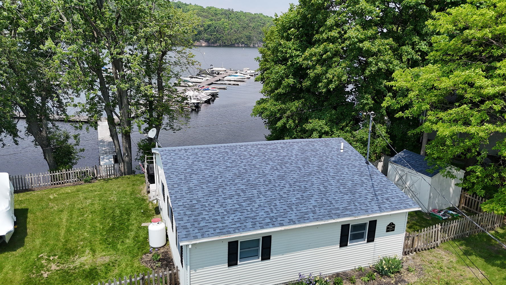 Residential roof replacement Colchester Vermont waterfront drone view