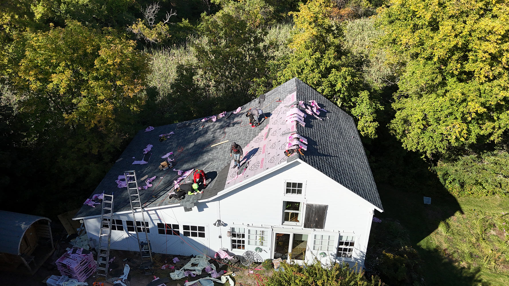 Shingle installation in progress on Williston Vermont farmhouse — charcoal shingles and ProArmor underlayment aerial view