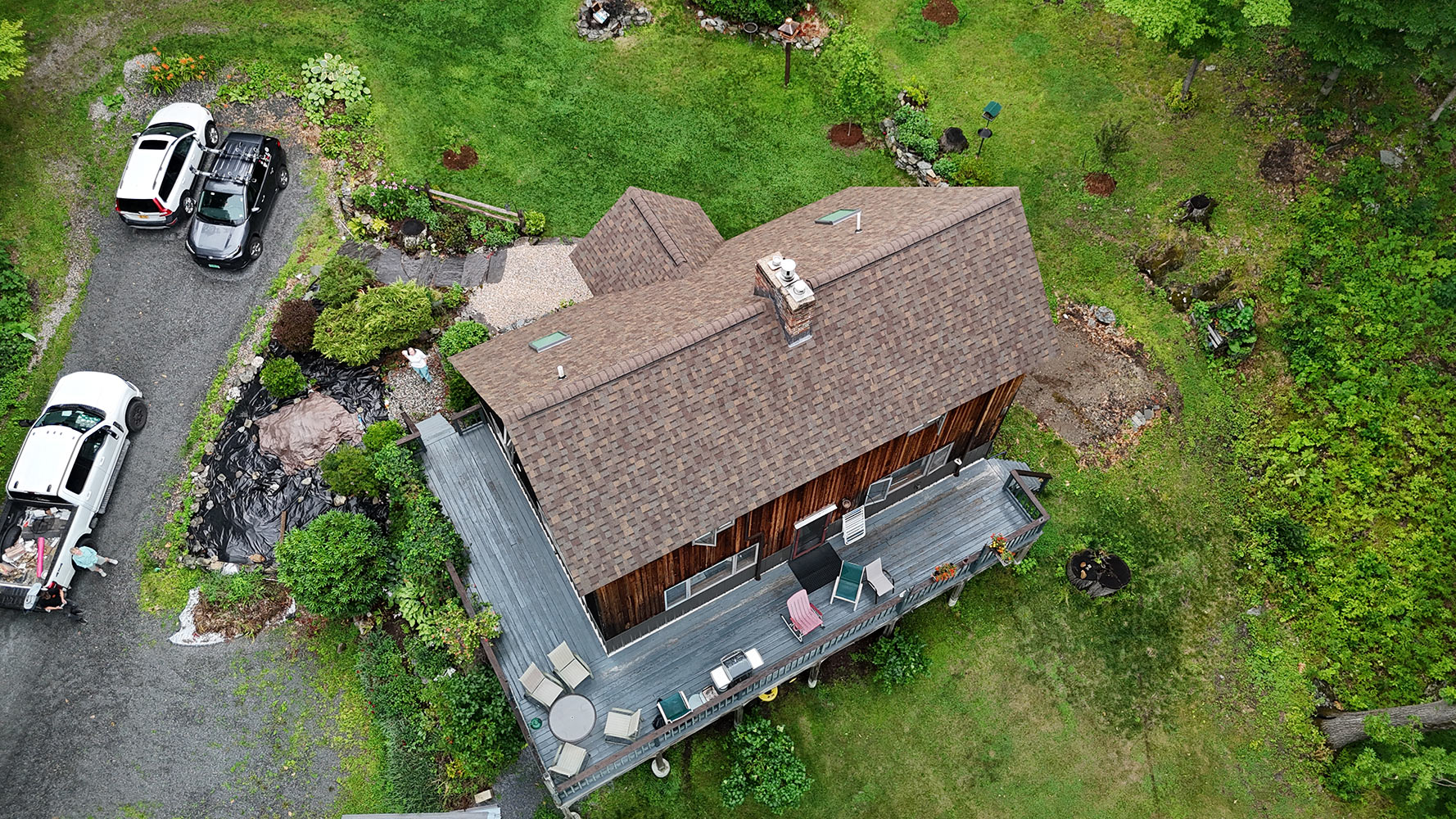 Completed shingle roof rear aerial view with skylights Richmond Vermont