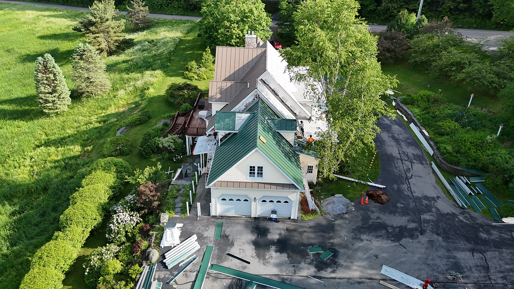 Standing seam metal roof installation Vermont summer aerial