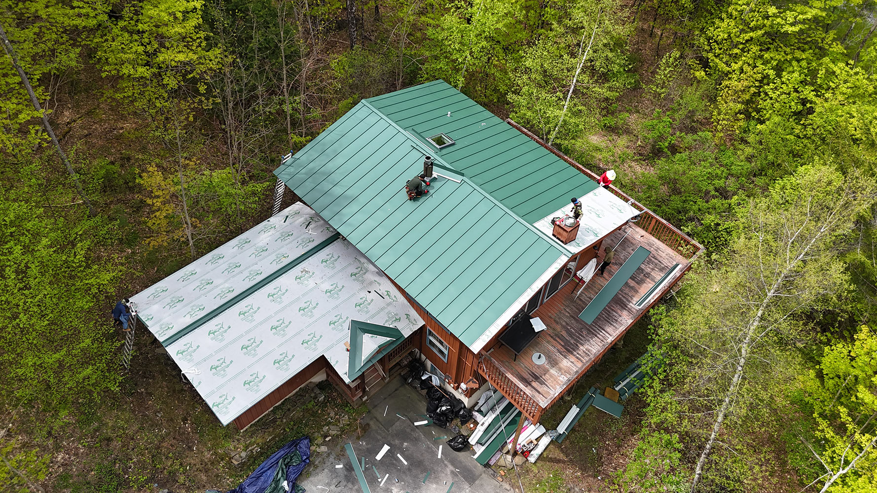 Standing seam metal roof Vermont cabin spring aerial