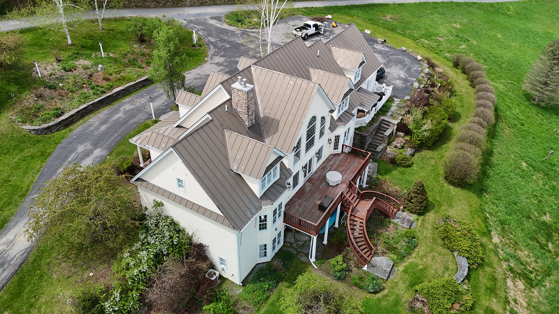 Standing seam metal roof completed on Vermont estate home aerial view